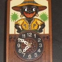 1950's German novelty pendulum wall clock featuring dark skinned boy with moving eyes - Sold for $439 - 2015