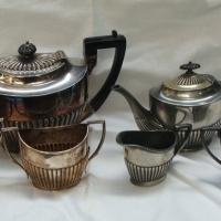 Group of Edwardian silver plated  tea pots, sugar basins and jugs - Sold for $37 - 2015