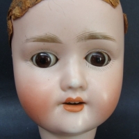 Lovely  Circa 1900 Schnoenau & Hoffmeister German bisque dolls head with glass sleeping eyes &  open mouth - Model number 1909 - Sold for $30 - 2015