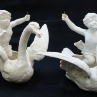 Pair of c1900  white BISQUE china cherubs riding swans, one marked 688 to base - Sold for $37 - 2015