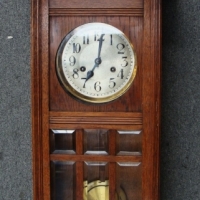 c1900 Oak Cased wall clock with pendulum and twin key wind - Sold for $317 - 2015
