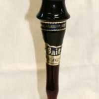 Small Biatz liquor bottle in shape of Olympic torch on a plastic stand - with printed label XVI Olympiad, Melbourne, Aust Nov 22 - Dec 8 1956 - Contai - Sold for $67 - 2015