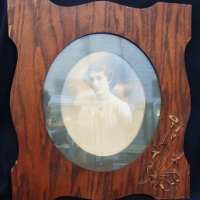 Vintage oval shaped ladies portrait photograph in plywood Art Nouveau frame with applied metal floral decoration - approx 295x235 - Sold for $73 - 2015