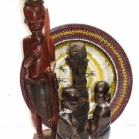 Group lot - Aboriginal Yarramunua handpainted bowl, African wooden figurine with feather headdress and carrying a spear, Pair of wooden African seated - Sold for $30 - 2015