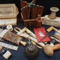 Small box lot of vintage sewing items including small wooden hosiery rack, wooden string rolls, expandable crochet tool, etc - Sold for $37 - 2016