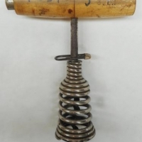 c1900's  'Foster's Lager' Spring cork screw with bladed worm and wooden handle - Sold for $27 - 2016