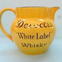 Dewer's white label water whisky jug  - black print on yellow - John Maddock - 9cm high - Sold for $37 - 2016
