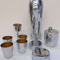 Art Deco German Zeppelin chrome plated brass cocktail shaker - pieces & accessories fitted inside - Sold for $183 - 2016