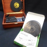 Vintage style Thorens Swiss music box movement in original wooden case with 12 song discs & leaflet - Sold for $55 - 2016