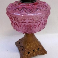 Vintage Falk, Stadelmann & Co kerosene lamp with cast base and cranberry glass tank - Sold for $67 - 2016