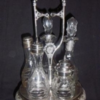 C1900 American silver plated & glass revolving  cruet set with five matching bottles - Sold for $37 - 2016