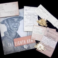 Group lot incl Australian Army rising sun hat badges, WW2 ration cards &  the Eight Army booklet - Sold for $24 - 2016