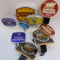 Group of beer tap labels including XXXX, Fosters and Cascade - Sold for $37 - 2016