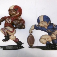 Pair of 1976 Homco cast aluminum grid iron footballer shaped  wall plaques - Sold for $24 - 2016