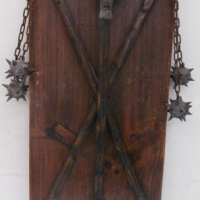 Decorative timber shield with mounted, medieval flails - Sold for $43 - 2016
