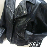 c1980's Black leather biker shirt with tassels to sleeves and back, size small to medium - Sold for $43 - 2016