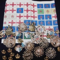 Group lot of English Military style badges plus poster with medals descriptions - Sold for $37 - 2016