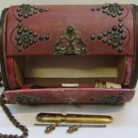Mid Victorian Leather sewing etui purse with pierced brass catch, tools and pin cushion - Sold for $186 - 2016