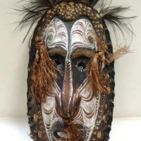 Vintage Papuan mask with pierced nose and inlaid cowrie shells - Sold for $50 - 2016