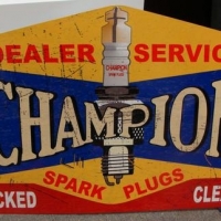 Reproduction shaped 'Champion Spark Plugs' tin advertising sign 61cm x 95cm - Sold for $99 - 2016