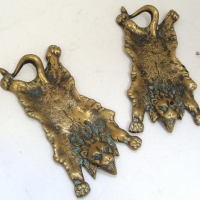 Pair of brass flattened lion dishes - Sold for $35 - 2016