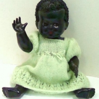 1950's English black hard plastic character baby Doll - flocked hair, open eyes - 31cms L - Sold for $75 - 2016