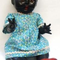 1950's black Rosebud hard plastic Doll - moulded hair, wearing red shoes, dress - 38cms L - Sold for $87 - 2016