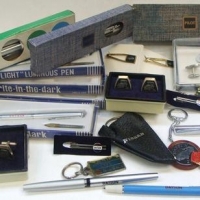Group of vintage Datsun and Nissan merchandise incl Flashlight pens, 240z  Key chain, Datsun cufflinks and tie pin etc - Sold for $124 - 2016