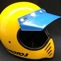 c1975 Moto3 Motorcycle helmet, yellow with blue visor - Sold for $37 - 2016