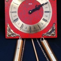 Lot 200 - Oriental 'Gong' wall clock - Red with gold decoration & decorative pendulum