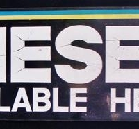 Lot 254 - Vintage 'Diesel - Available Here' tin advertising sign approx 30cm x 90cm