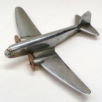 c1950's Chrome DC3 model airplane with plastic discs for propellers - Sold for $31 - 2016