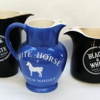 2 x Vintage Black and White whisky advertising water jugs made by Wade - Sold for $25 - 2016