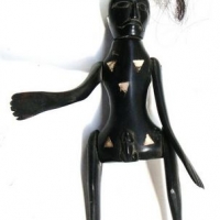 Craved horn articulated human figurine with shell inlay - Sold for $75 - 2016