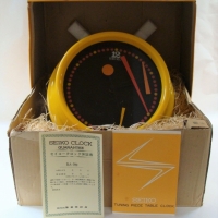 1970's Retro Seiko battery operated wall clock - yellow with displaced hands 'as new' in box - Sold for $199 - 2016