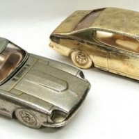 2 x Vintage novelty gilt metal car shaped cigarette boxes incl DATSUN 180B SSS with music & DATSUN 240Z - Sold for $35 - 2016