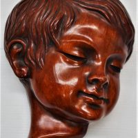 German Ceramic wall mask of a Young boy - Sold for $31 - 2018