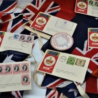 Group with Bunting flags, and QANTAS Coronation first day covers - Sold for $87 - 2018