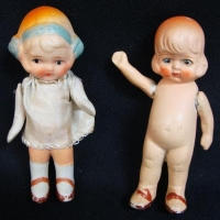 2 x 1920's bisque dolls with moving arms, hand painted detailing & molded features - one marked foreign, other Japan, approx 10cm L - Sold for $43 - 2016