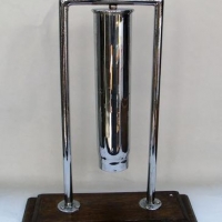 Lot 328 - Large Chrome plated artillery shell dinner gong on wooden base - approx h 51cm - Sold for $50