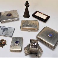 Box of cases and souvenir war incl Ballarat Vesta, celluloid vanity, chrome cigarette cases with shipping badges etc - Sold for $43 - 2019