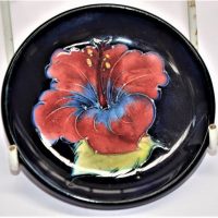 Moorcroft Hibiscus pattern pin dish with paper label to base 8cm diameter - Sold for $62 - 2019