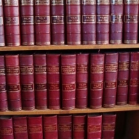 Lot 105 - 1910 Encyclopedia Britannica 29 volume set plus index, bound in quarto red leather - Sold for $211