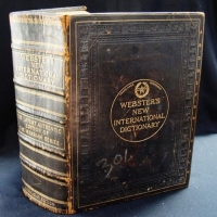 Lot 106 - 1909 leather bound Webster's dictionary Mirriam edition - Sold for $50