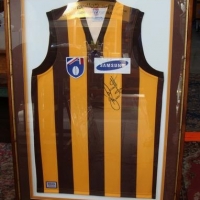 Lot 125 - Signed and framed presentation - AFLVFL Hawthorn FC 'Dermott Brereton' jumper - approx 85x56cm - Sold for $161