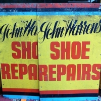2 x vintage tin advertising signs for John Warren's Shoe Repairs - red & black text on yellow ground - approx 92x57cm - Sold for $31