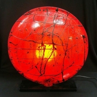 1990's red plastic circular lamp with black abstract trailing - Sold for $62