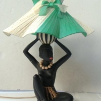 Lot 346 - Vintage Barsony style black lady lamp with original ribbon shade & number 36154 impressed to side - Sold for $124