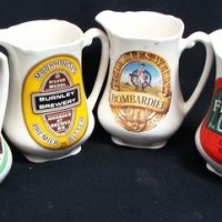 4 x vintage Staffordshire Pottery advertising jugs inc - Charles Wells, Wiltshire Brewing, Five Towers and Burnley Brewery - Sold for $99