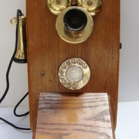c1930's Britain Ericsson timber wall phone with brass mouth piece - Sold for $149